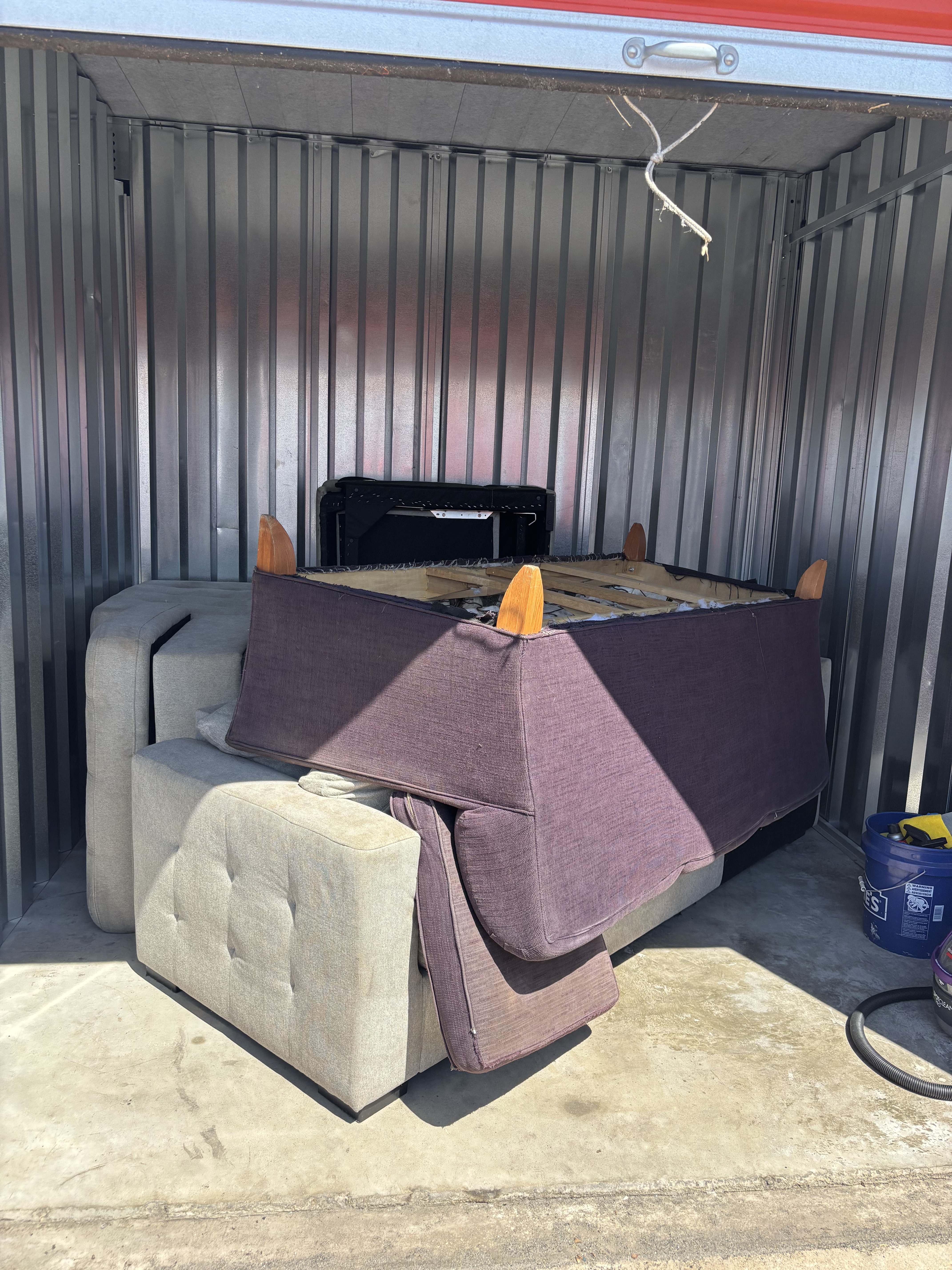 Rundown room full of old furniture before removal Seattle